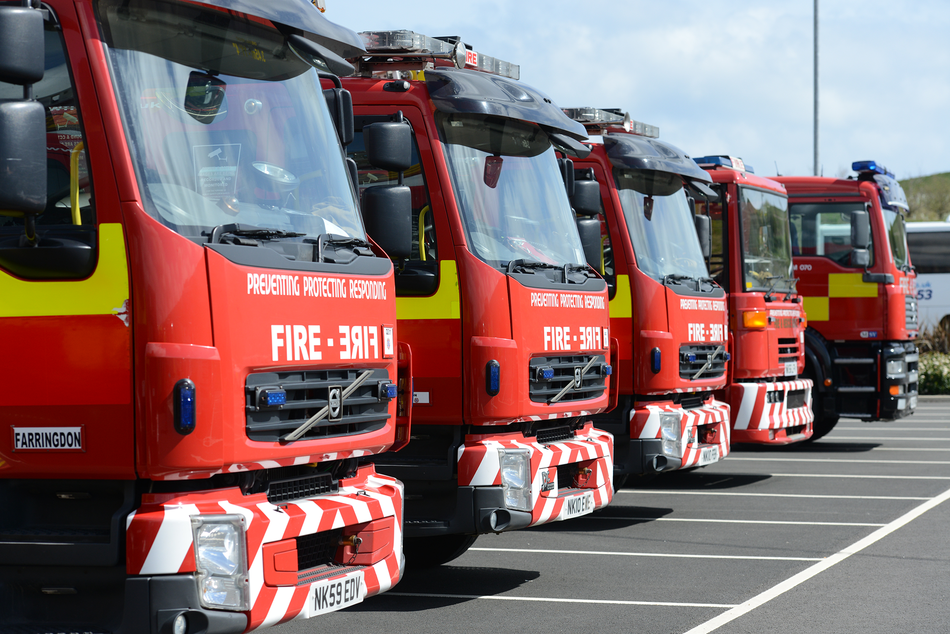 Photograph of a row of parked fire engines