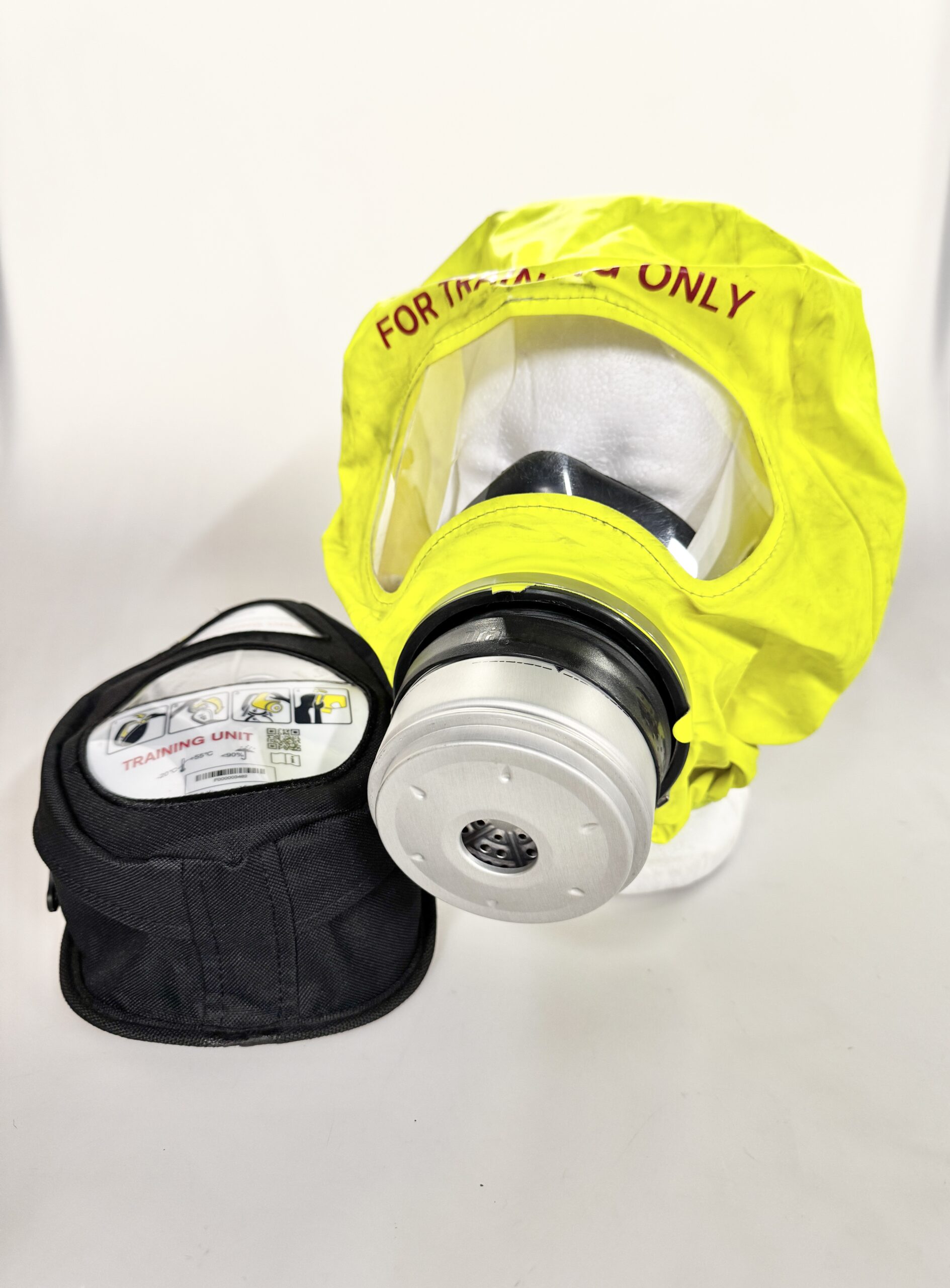 Photograph of a Fire escape hood with and the container it comes in
