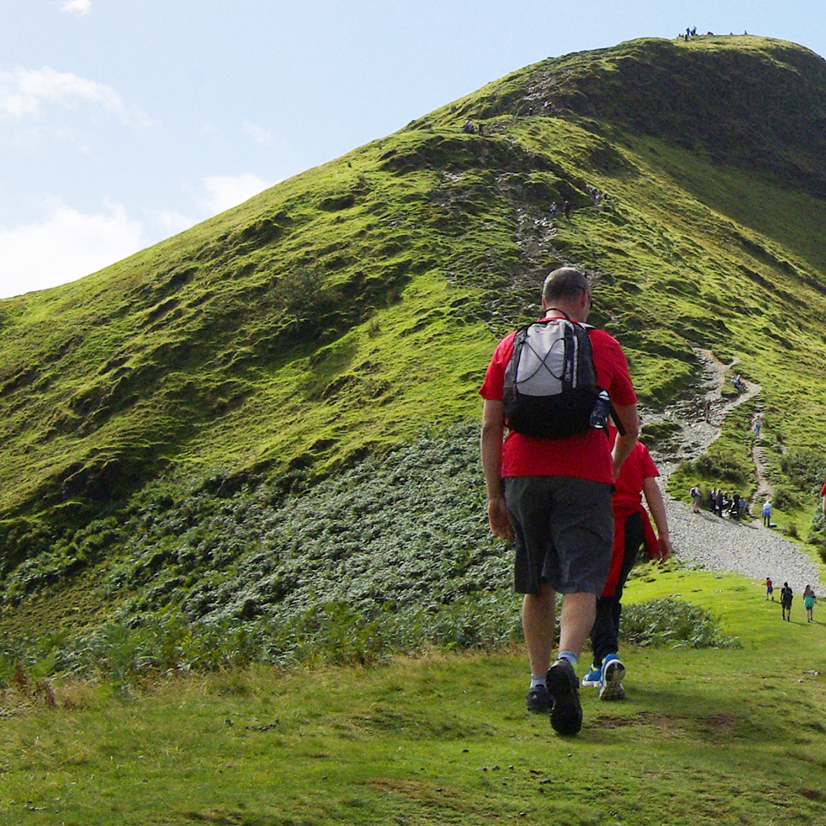 photograph of people out walking in the hills