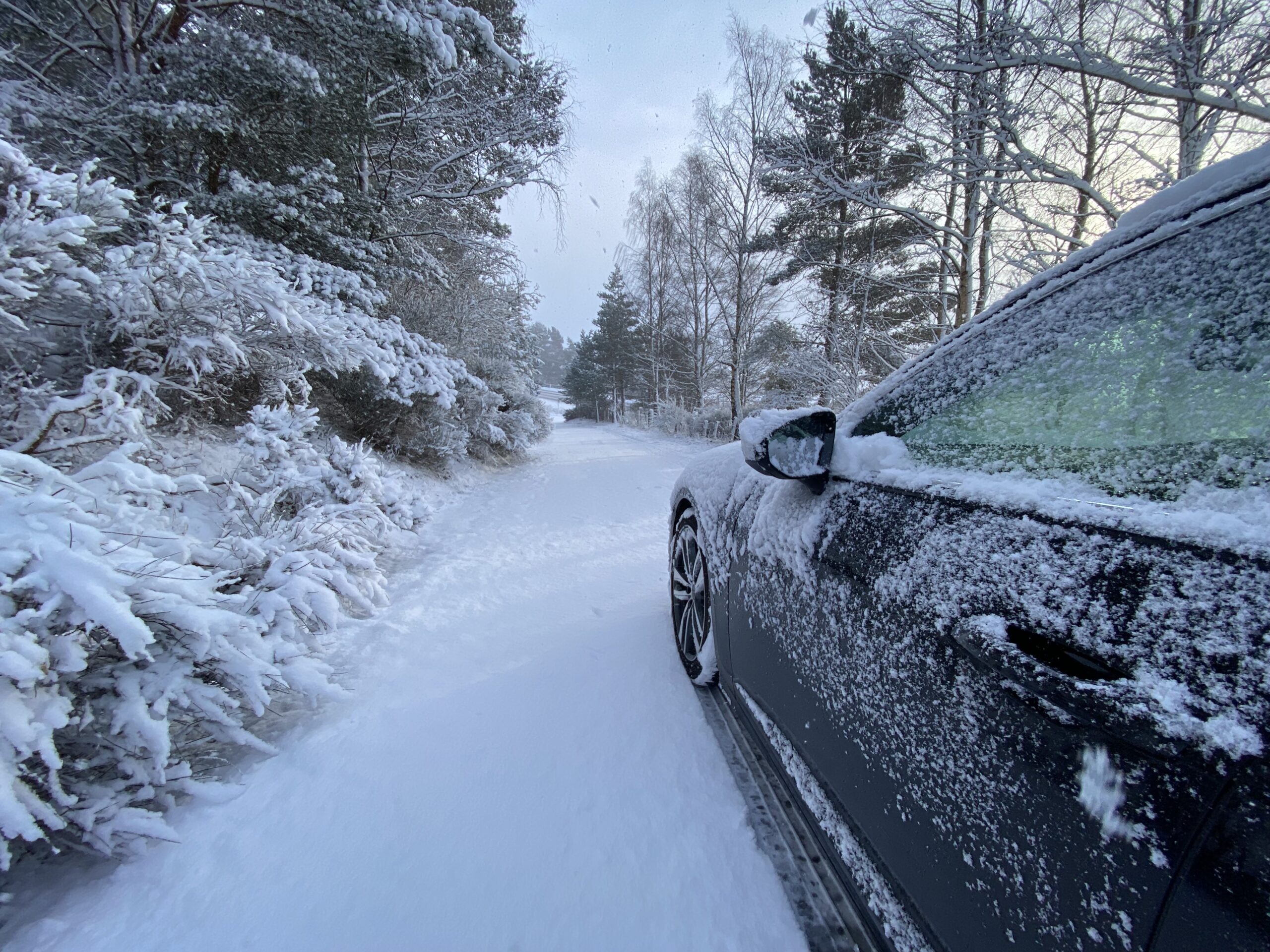 photograph of a Car on the road in snow