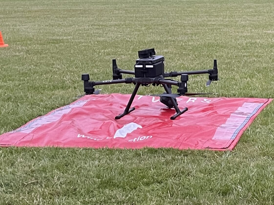 Photograph of the Matrice 300 UAS 1 drone, on a red matt